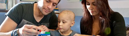 A young patient and parents at the Children's Brain Tumour Research Centre
