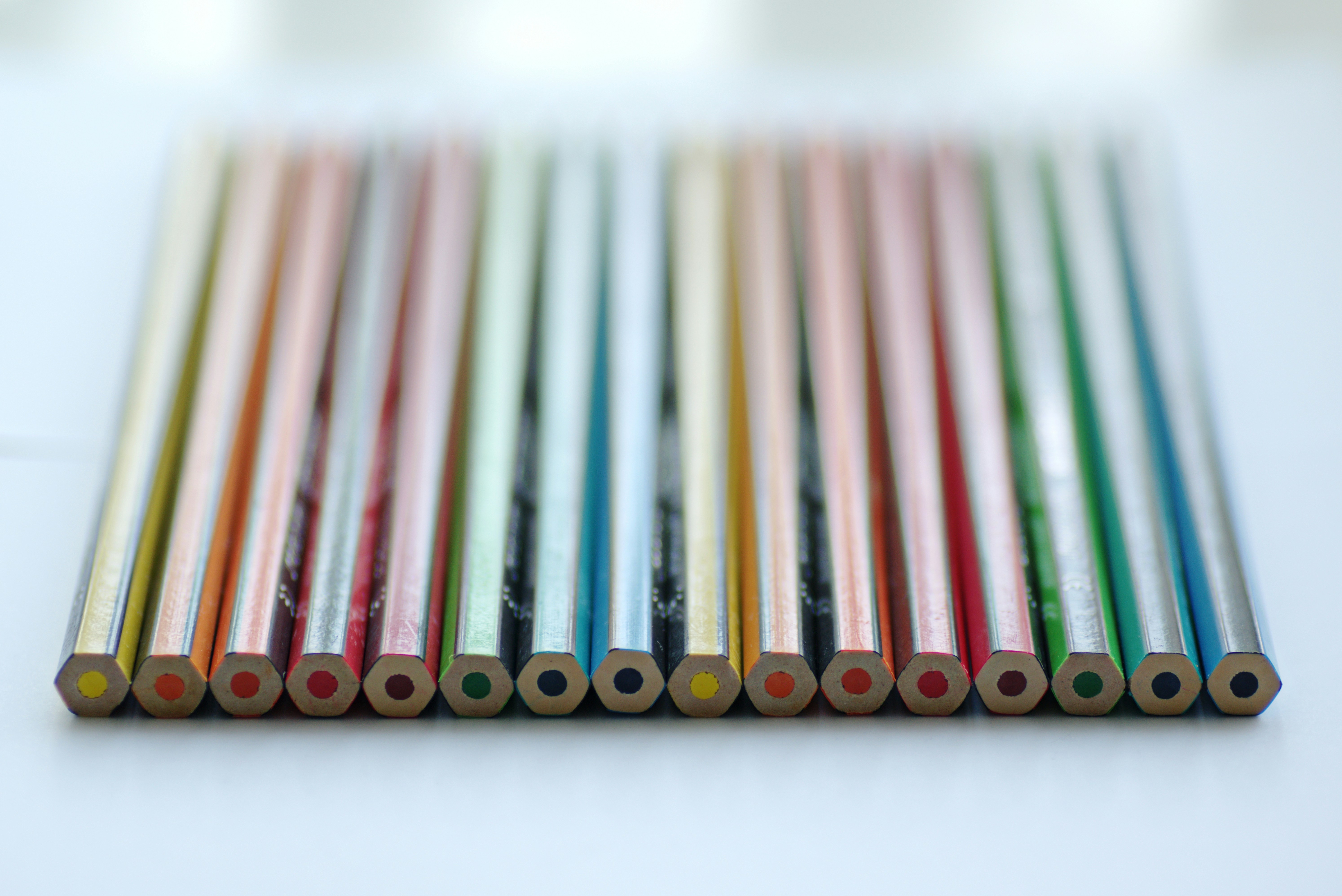 Coloured pencils lined up on a table