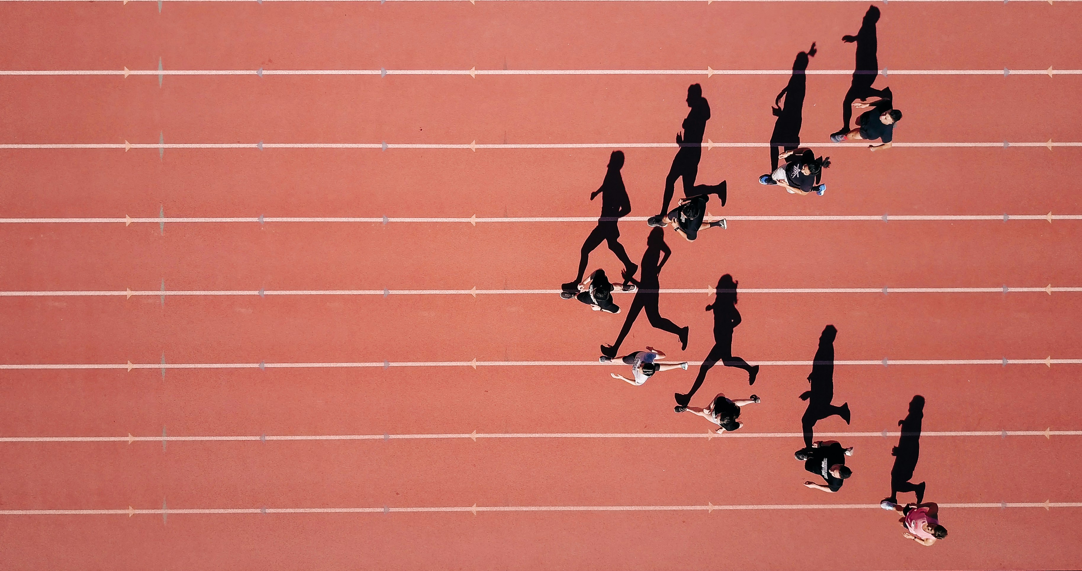 Athletes running on a race track