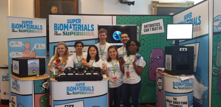 Student helpers standing behind the display at the Royal Society Summer Science Exhibition 2020