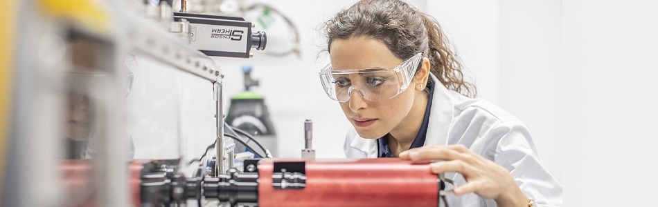 A research student working in a engineering lab.