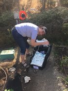 Mandy setting up microdialysis in a vegetable garden
