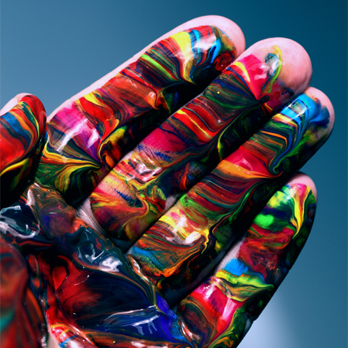 Close up of hand painted covered in colourful abstract design