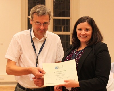 Prof Ian Hall presenting the Young Investigator Competition winner Dr Heather McLaughlin with her certificate.