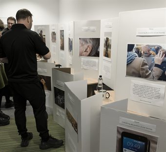 People viewing the photography exhibition