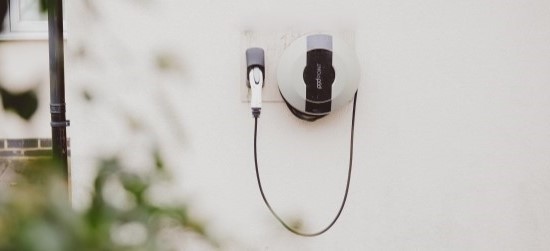 Electric vehicle charging point on wall