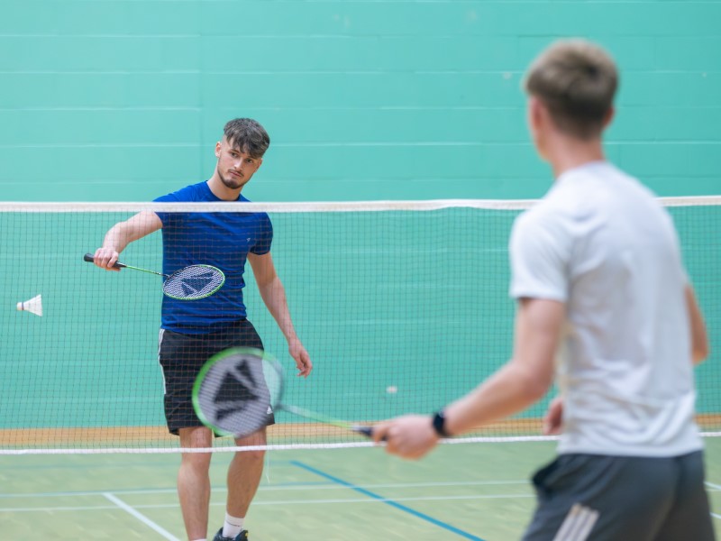 Two pupils try badminton at David Ross Sports Village