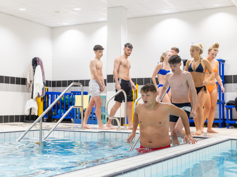 Pupils enter the ice pool at the Sports Injury Clinic