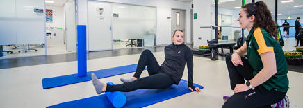 A physiotherapist working with a student on her rehabilitation in our Sports Injury Clinic