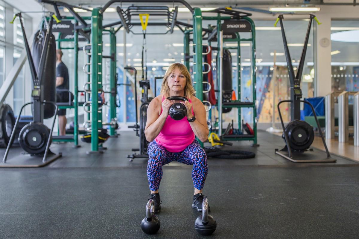 Female lifting free weights at David Ross Sports Village