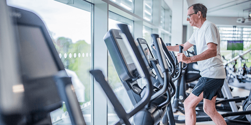 A member working out on the cross trainer at David Ross Sports Village