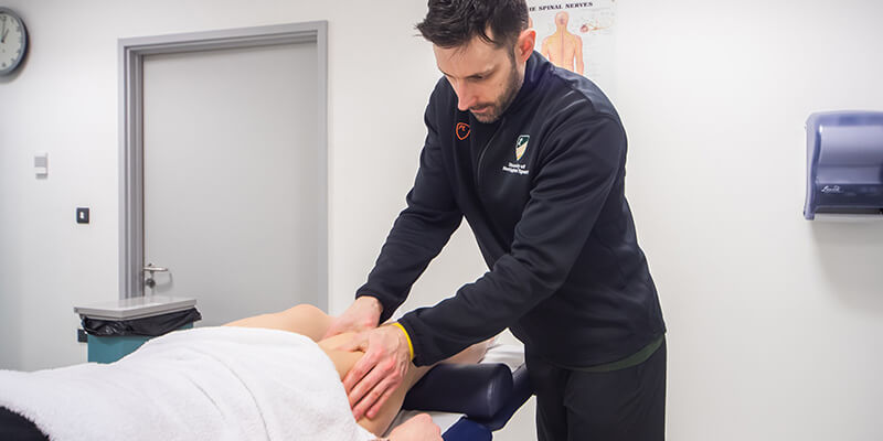 A patient receiving a sports massage from one of our sports massage therapists in our Sports Injury Clinic