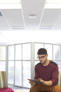 Male undergraduate student on an iPad, School of Pharmacy
