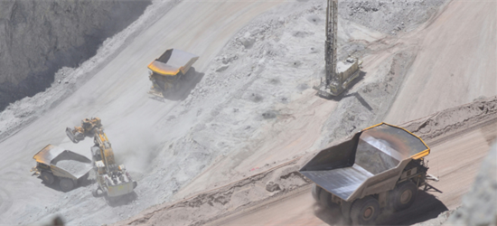 Large open air copper mine with digging equipment and trucks