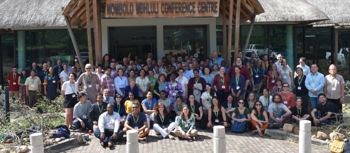 Photo of large group of people outside the Nombolo Mdhluli Conference Centre in South Africa .