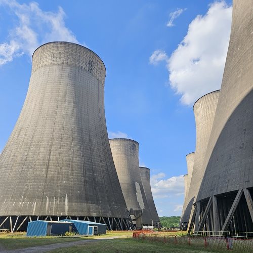 Concrete cooling towers against a blue sky at the Uniper site.