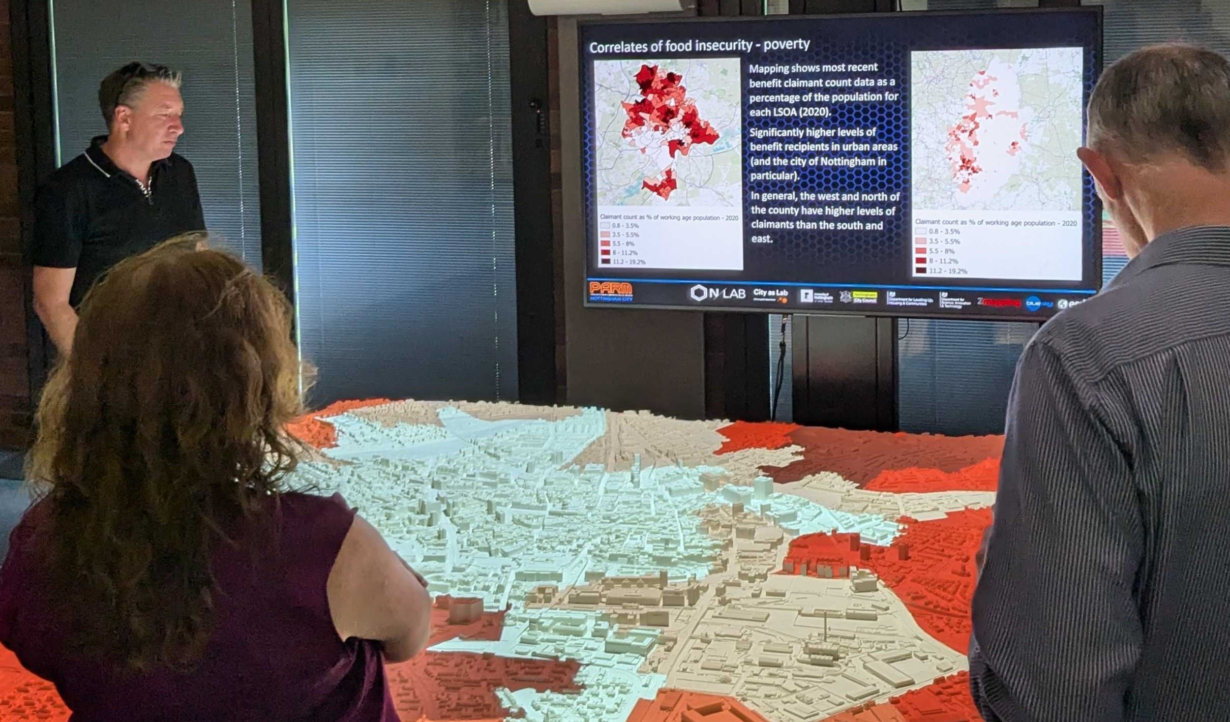 People watching a demonstration of the Projected Augmented Relief Model