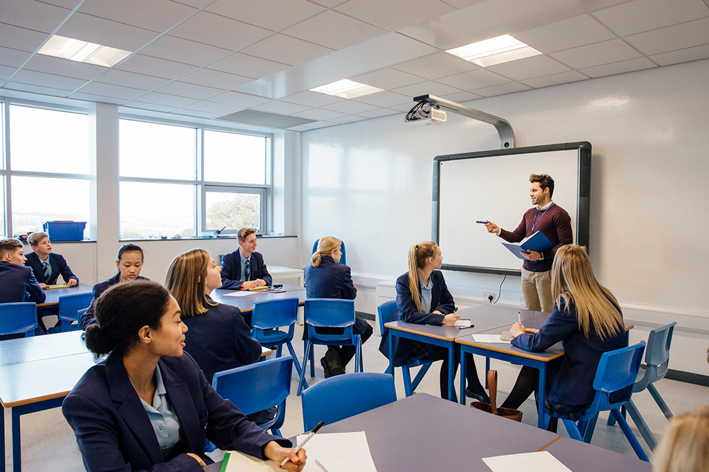 students in classroom looking at teacher