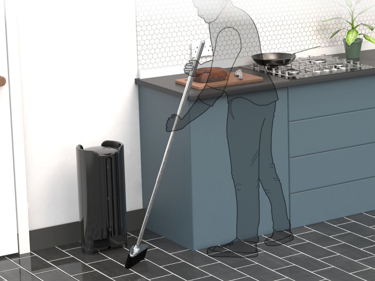 Sweep being used in a kitchen