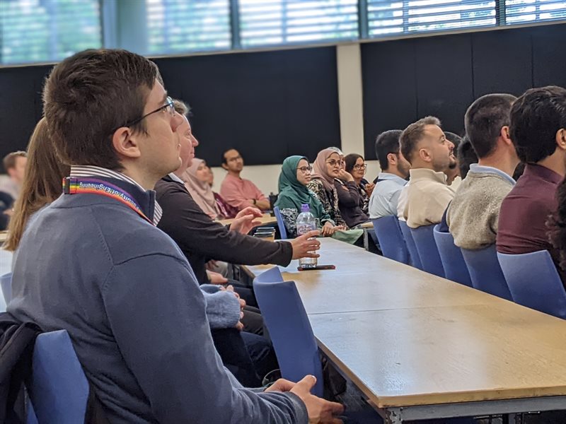 Students sat in a seminar room listening to a panel discussion on senior staff career paths