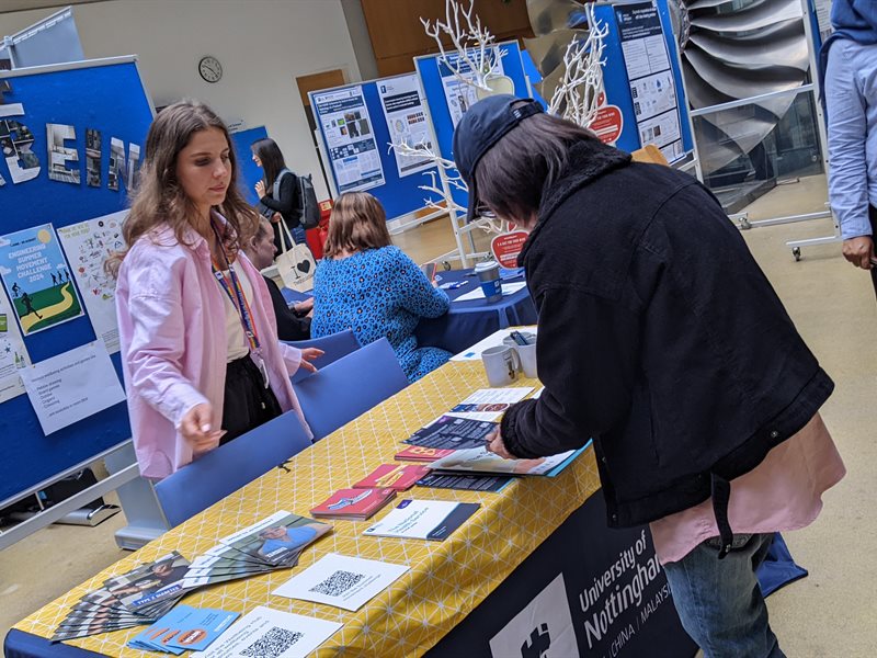 People looking at leaflets at the stand for wellbeing in the Faculty of Engineering