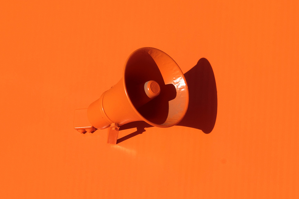 A bright orange megaphone