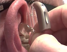 How do I take my hearing aids out?
