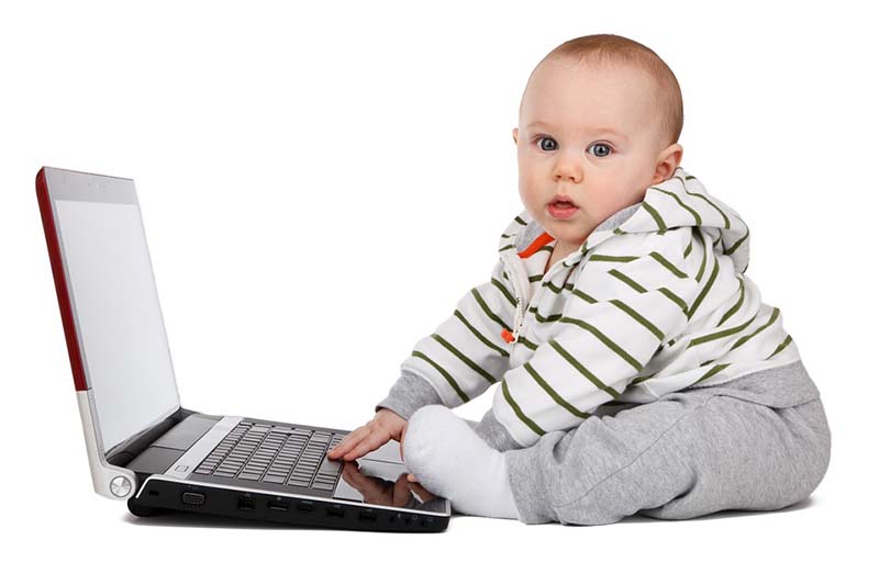 A baby using a laptop computer