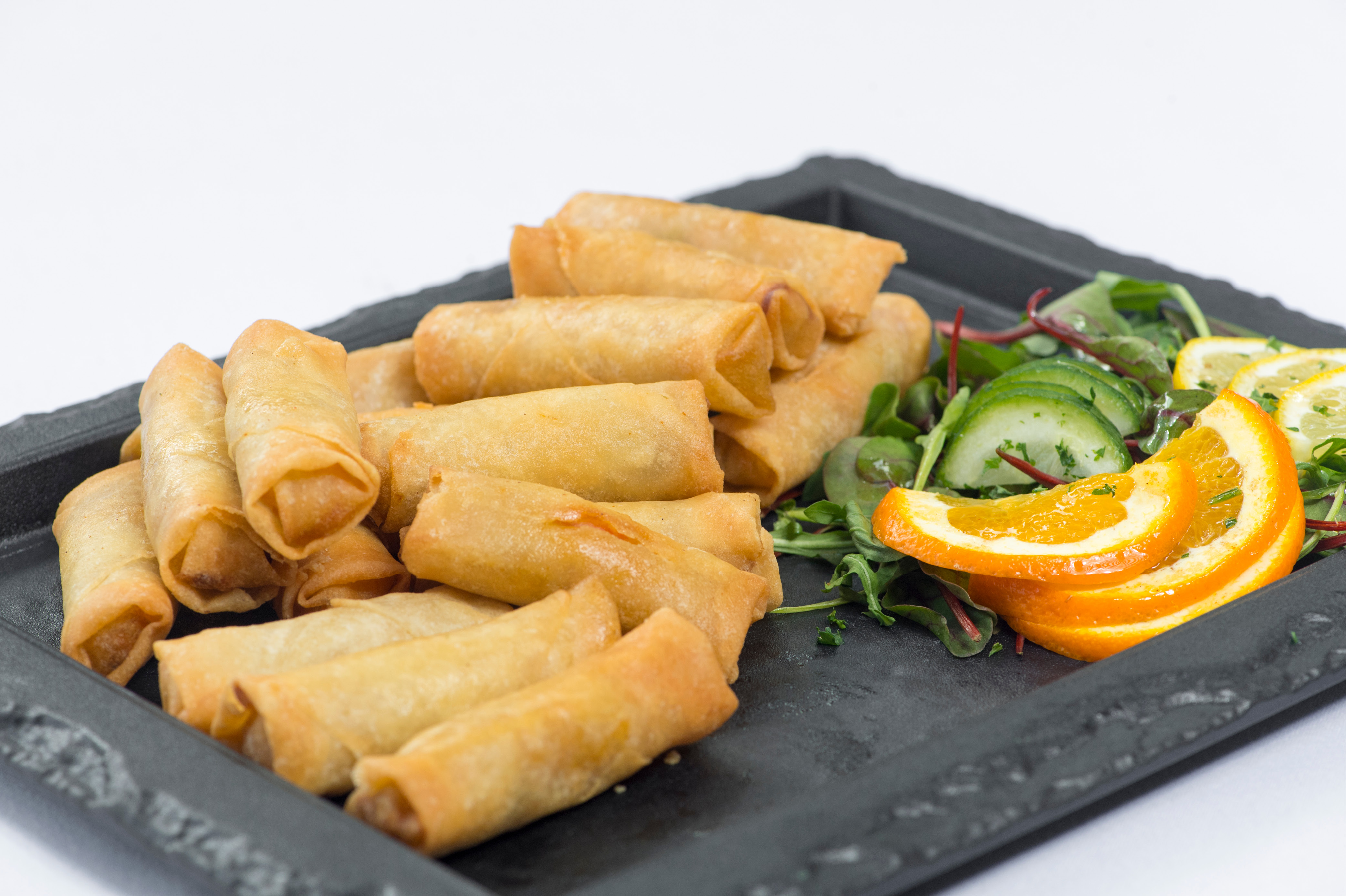 Image of spring rolls on a slate plate