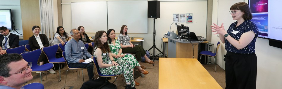 Academic delivering a presentation to an interested audience