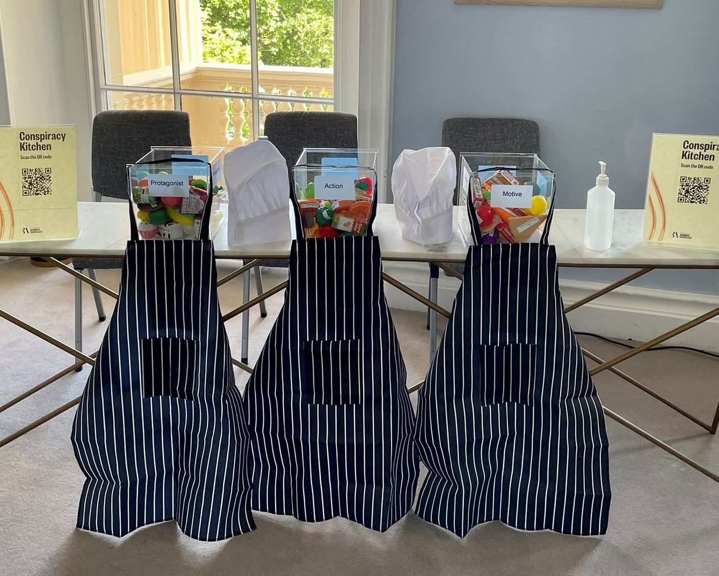 Conspiracy Kitchen activity including three aprons and chef hats