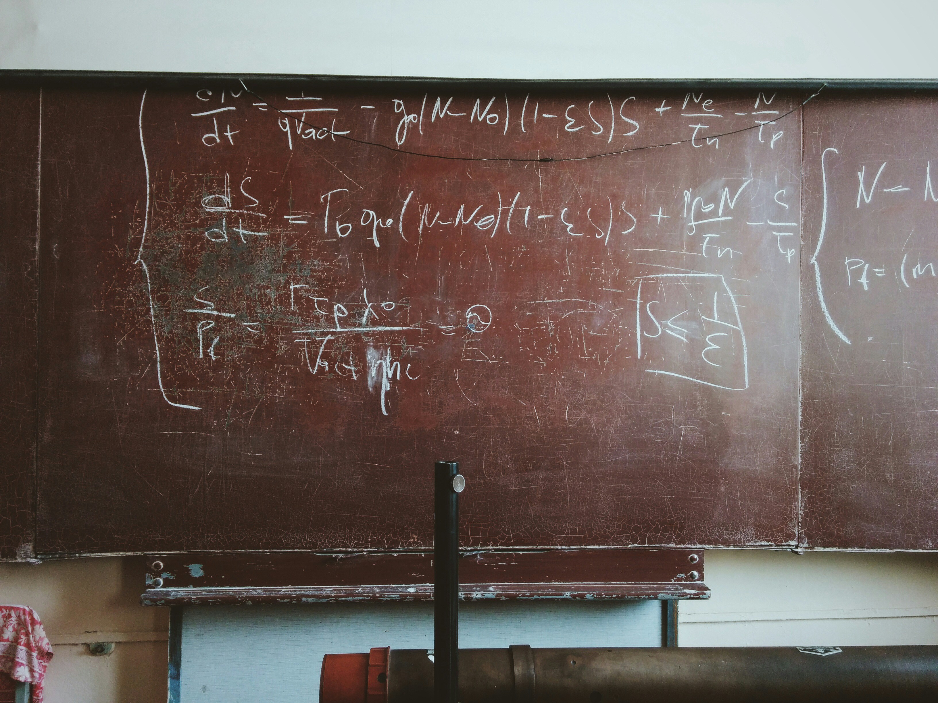 A blackboard showing a maths equation