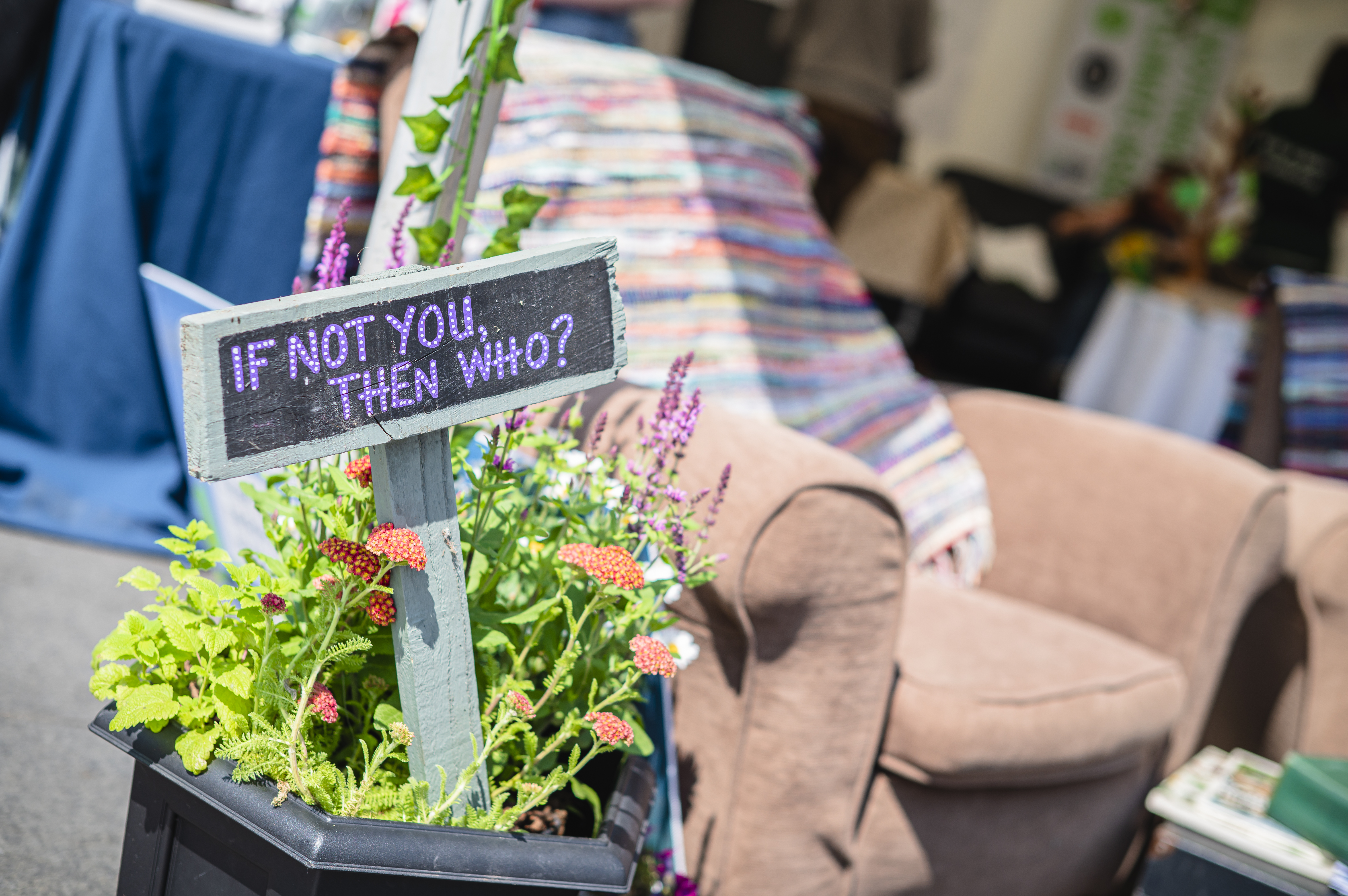 Image of planter at Green Hustle with a sign saying If not you, then who