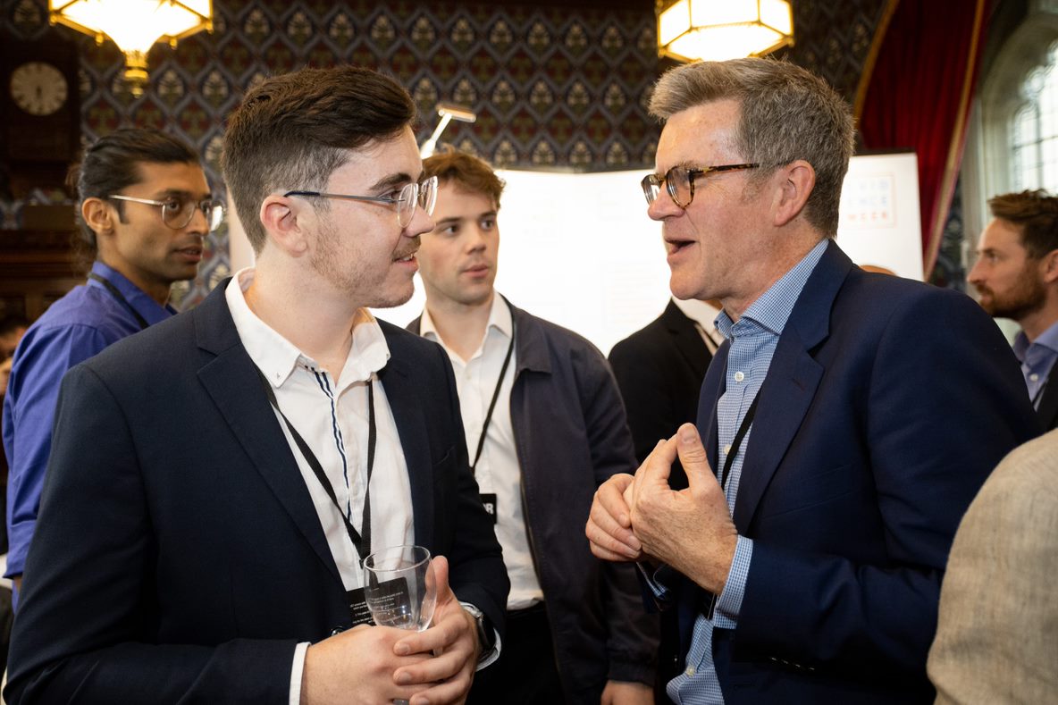 Stephen Meek and Max Gillingham chatting at reception event