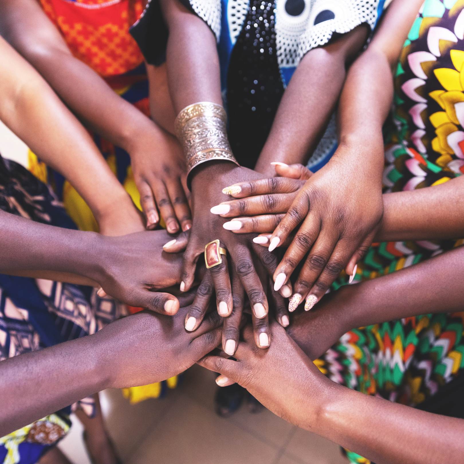 A group of women holding each other