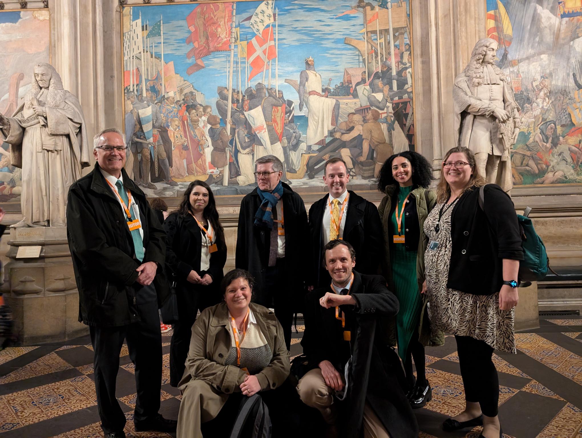 A group of people smiling and posing for a picture