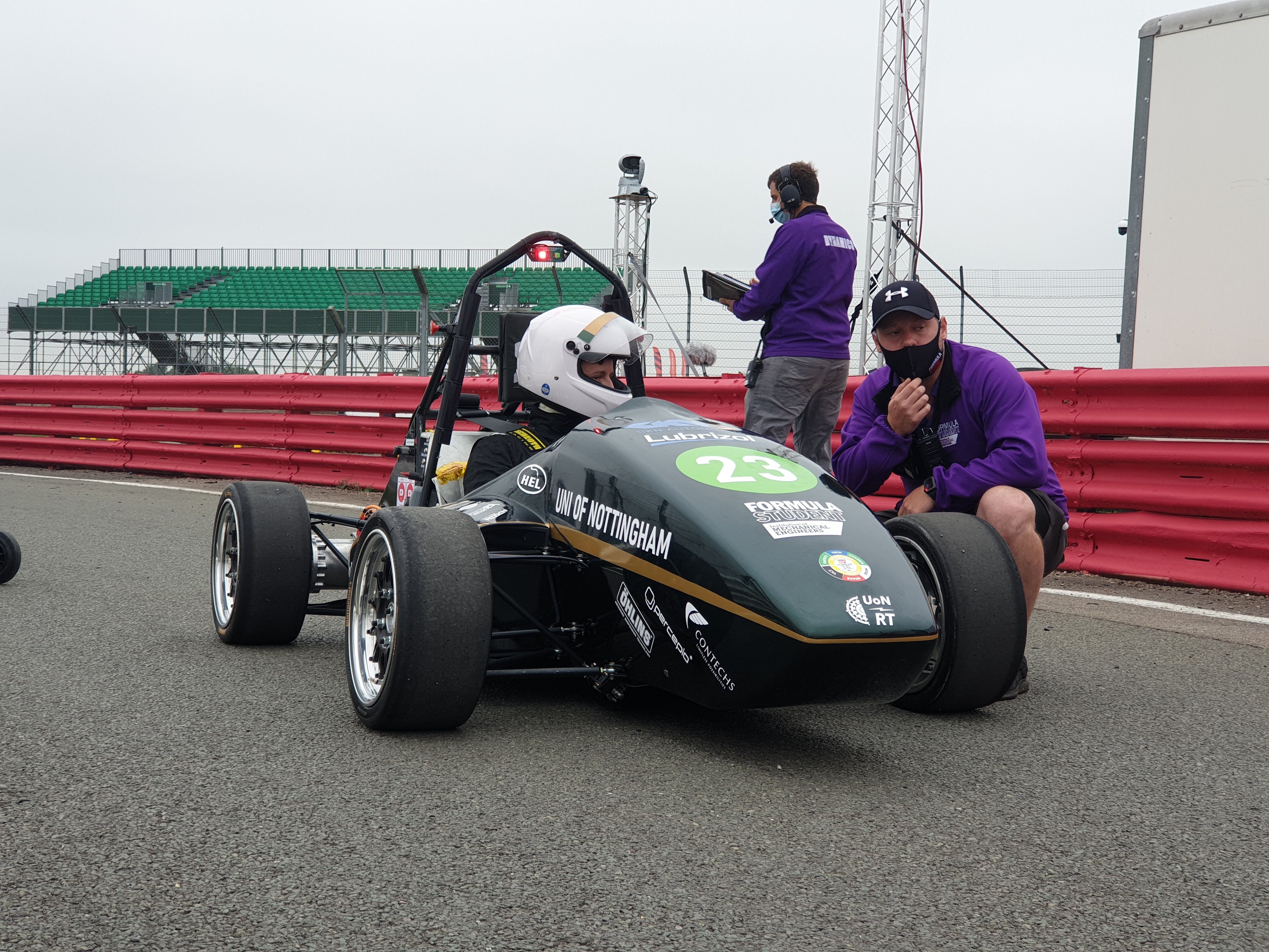 2021 Car - Frontal View with Driver inside talking to race officials.