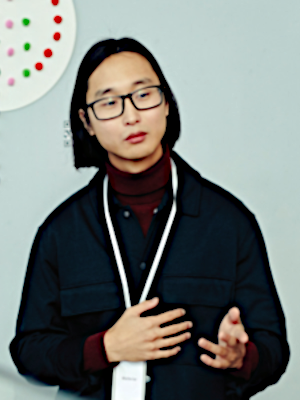 Young man presenting lecture, gesturing with hands