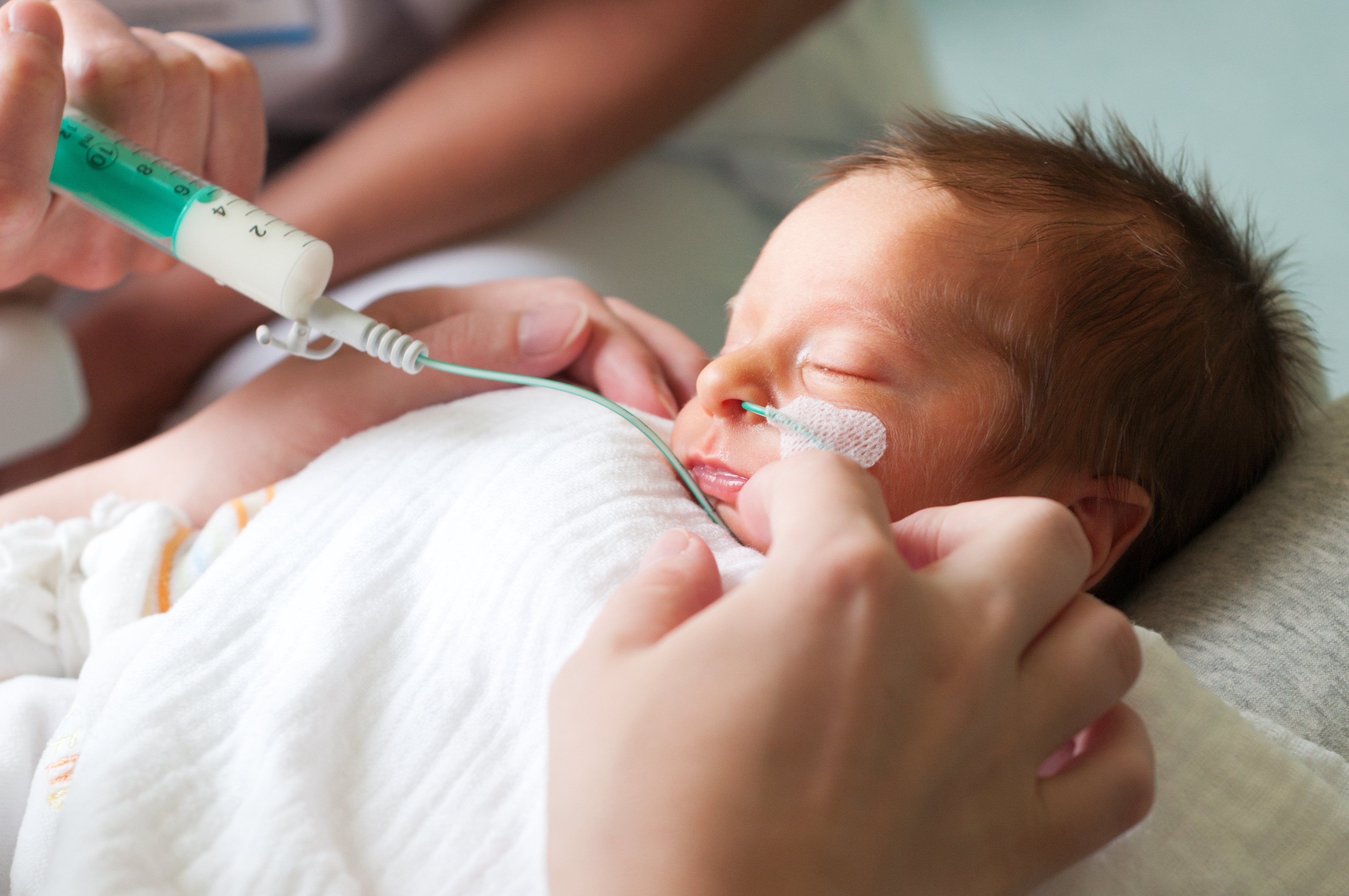 New born baby being treated