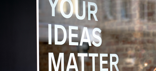 Glass door with the words "Your ideas matter" printed on it