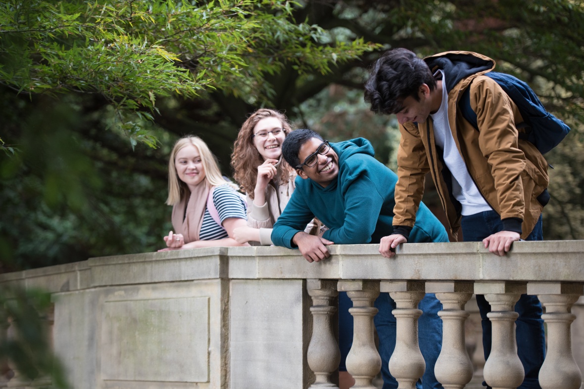 Undergraduate students relaxing around Highfields Lake, University Park
