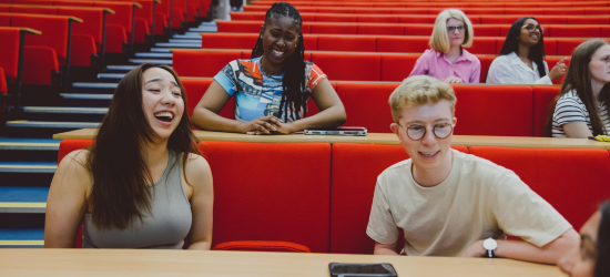 Group of students sat in a lecture theatre