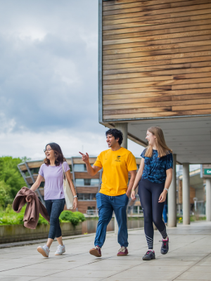 Three students finding their way around campus