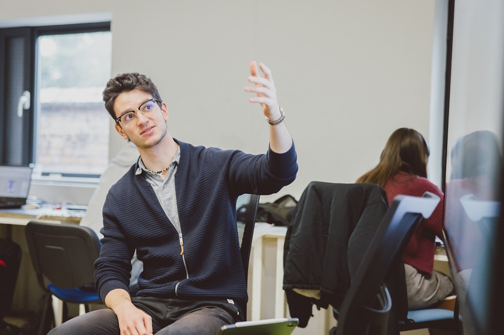 Student presenting to people on their course