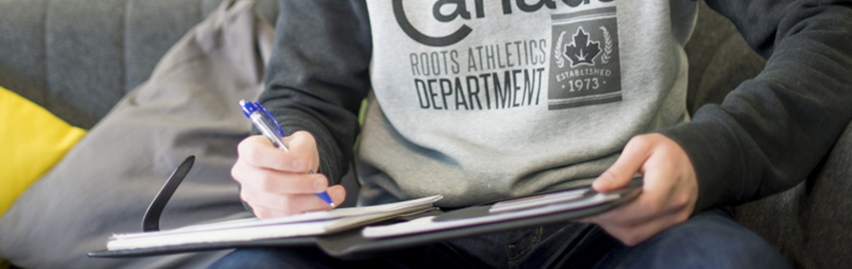 Student writing in a halls of residence