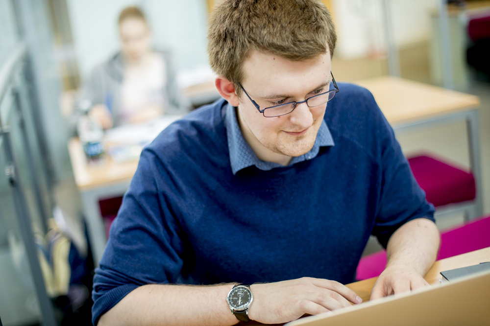 Student working on a laptop