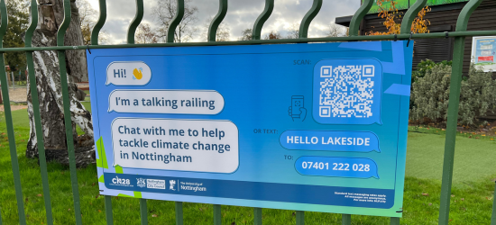 photo of the banner with text bubbles reading 'hi! wave emoji''I'm a talking railing''Chat with me to help tackle climate change in Nottingham'